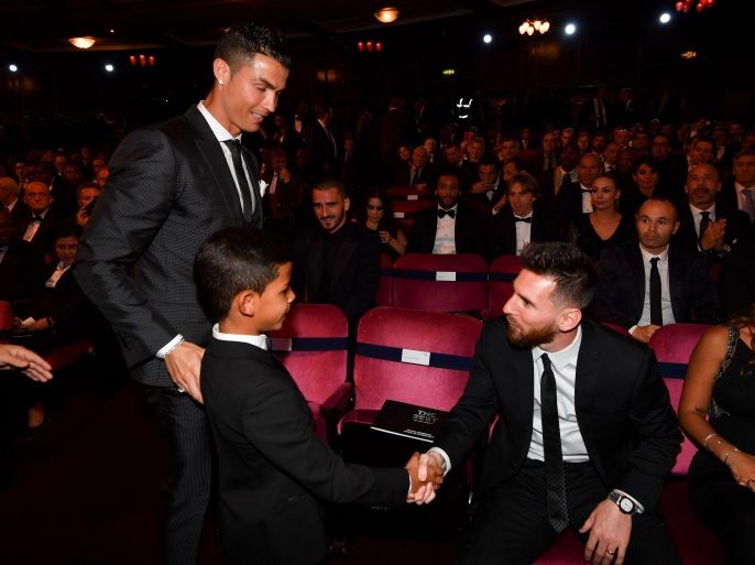 Nominee for the Best FIFA football player, Barcelona and Argentina forward Lionel Messi (2nd R) shakes hands with Cristiano Ronaldo Jr, son of Real Madrid and Portugal forward Cristiano Ronaldo (L) before The Best FIFA Football Awards ceremony, on October 23, 2017 in London. / AFP PHOTO / Ben STANSALL (Photo credit should read BEN STANSALL/AFP/Getty Images)