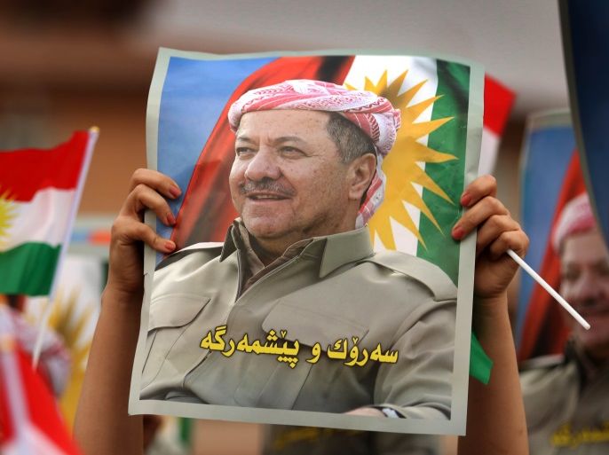 Iraqi Kurdish students of the Salahaddin University hold posters of Iraqi Kurdish leader Massud Barzani during a protest in his support in Arbil, the capital of autonomous Iraqi Kurdistan, on October 30, 2017.Long-time Kurdish leader Massud Barzani, the architect of the referendum, announced on October 29, 2017 he is stepping down after it led to Iraq's recapture of almost all disputed territories that had been under Kurdish control. / AFP PHOTO / SAFIN HAMED (P