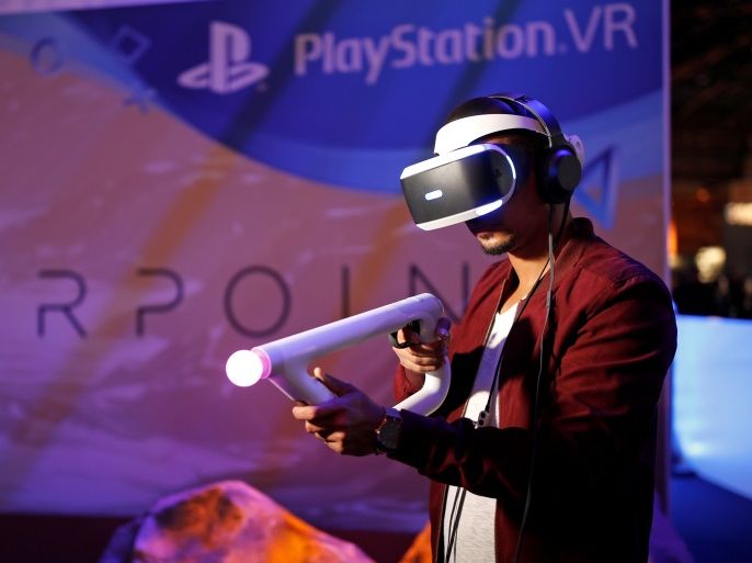 A man plays Farpoint on a Sony PlayStation VR at the Paris Games Week, a trade fair for video games in Paris, France, October 26, 2015. REUTERS/Benoit Tessier