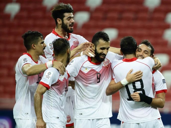 SINGAPORE - NOVEMBER 14: Jamal Rashed of Bahrain (R) celebrates with teammates after scoring the second goal during the 2019 Asian Cup Qualifier match between Singapore and Bahrain at National Stadium on November 14, 2017 in Singapore. (Photo by Suhaimi Abdullah/Getty Images)
