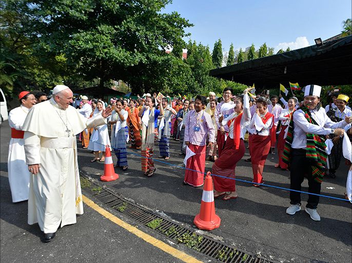 epa06353690 A handout photo made available the Vatican newspaper L'Osservatore Romano shows Pope Francis (L) arriving at the Yangon International Airport in Yangon, Myanmar, 27 November 2017. Pope Francis' visit in Myanmar and Bangladesh runs from 27 November to 02 December 2017. EPA-EFE/L'OSSERVATORE ROMANO HANDOUT HANDOUT EDITORIAL USE ONLY/NO SALES