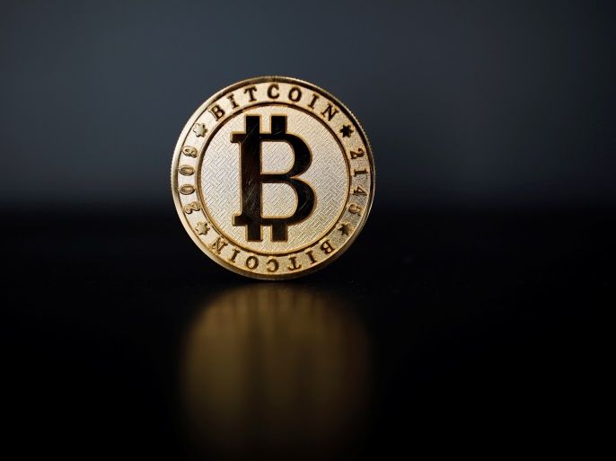 A Bitcoin (virtual currency) coin is seen in an illustration picture taken at La Maison du Bitcoin in Paris, France, June 23, 2017. REUTERS/Benoit Tessier/Illustration