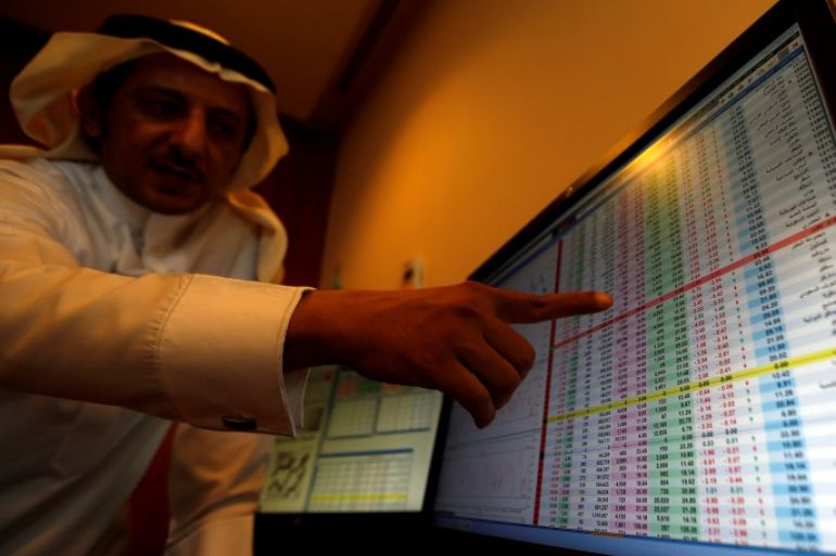 An investor gestures as he monitors a screen displaying stock information in Riyadh, Saudi Arabia, November 6, 2017. REUTERS/Faisal Al Nasser