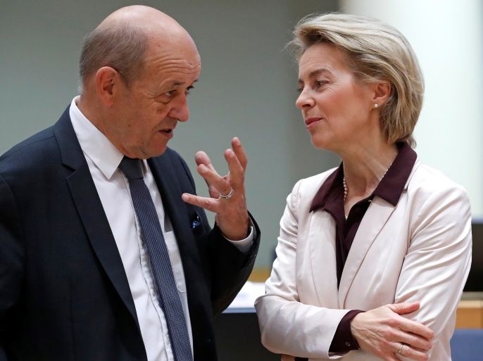 French Foreign Affairs Minister Jean-Yves Le Drian (L) and German Defence Minister Ursula von der Leyen attend an European Union foreign and defence ministers' meeting in Brussels, Belgium, November 13, 2017. REUTERS/Yves Herman