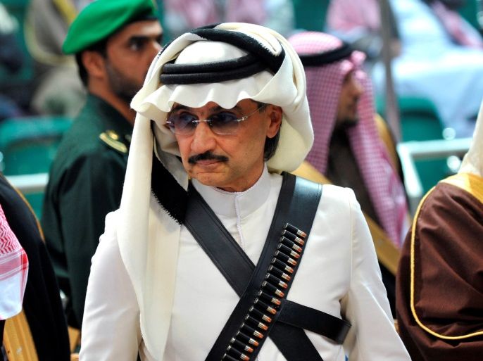 Prince Alwaleed bin Talal attends the traditional Saudi dance known as 'Arda', which was performed during Janadriya culture festival at Der'iya in Riyadh February 18, 2014. REUTERS/Fayez Nureldine/Pool/File Photo