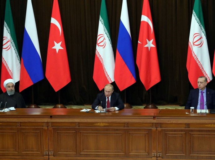 Iran's President Hassan Rouhani together with his counterparts, Russia's Vladimir Putin and Turkey's Tayyip Erdogan, attend a joint news conference following their meeting in Sochi, Russia November 22, 2017. Sputnik/Mikhail Klimentyev/Kremlin via REUTERS ATTENTION EDITORS - THIS IMAGE WAS PROVIDED BY A THIRD PARTY.