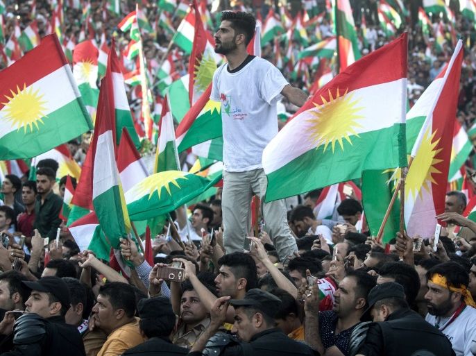 ERBIL, IRAQ - SEPTEMBER 22: Kurdish people show their support for the upcoming referendum for independence of Kurdistan at a massive rally held at the Erbil Stadium on September 22, 2017 in Erbil, Iraq. The Kurdish Regional government is preparing to hold the September 25, independence referendum despite strong objection from neighboring countries and the Iraqi government, which voted Tuesday to reject Kurdistan's referendum and authorized the Prime Minister Haider al-Abadi to take measures against the vote. Despite the mounting pressures Kurdistan President Masoud Barzani continues to campaign and state his determination to go ahead with the vote. (Photo by Chris McGrath/Getty Images)