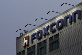 The logo of Foxconn, the trading name of Hon Hai Precision Industry, is seen on top of the company's headquarters in New Taipei City, Taiwan March 29, 2016. REUTERS/Tyrone Siu/File Photo TPX IMAGES OF THE DAY