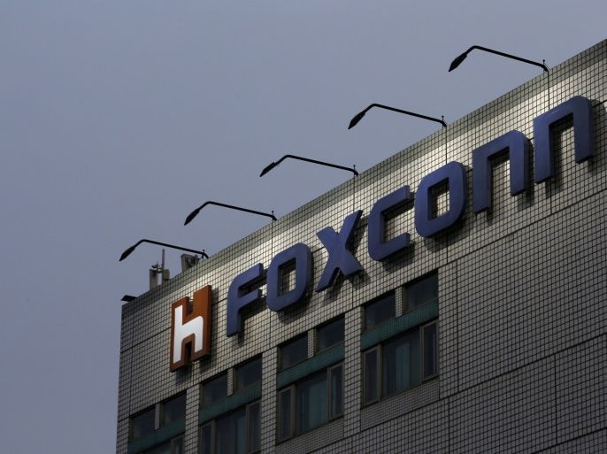 The logo of Foxconn, the trading name of Hon Hai Precision Industry, is seen on top of the company's headquarters in New Taipei City, Taiwan March 29, 2016. REUTERS/Tyrone Siu/File Photo TPX IMAGES OF THE DAY