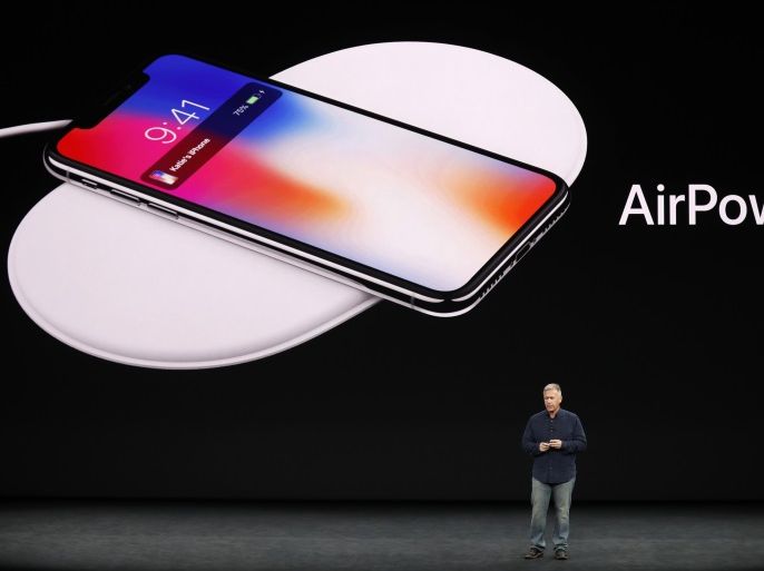 Apple Senior Vice President of Worldwide Marketing, Phil Schiller, shows the AirPower wireless charging mat during a launch event in Cupertino, California, U.S. September 12, 2017. REUTERS/Stephen Lam