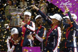Tennis - Fed Cup Final - Belarus v United States - Chizhovka Arena, Minsk, Belarus, November 12, 2017 - members of the U.S. team celebrate with the trophy after defeating Belarus. REUTERS/Vasily Fedosenko