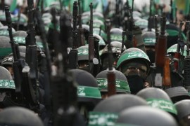 Palestinian members of al-Qassam Brigades, the armed wing of the Hamas movement, take part in a military parade marking the 27th anniversary of Hamas' founding, in Gaza City December 14, 2014. REUTERS/Mohammed Salem (GAZA - Tags: POLITICS MILITARY ANNIVERSARY)