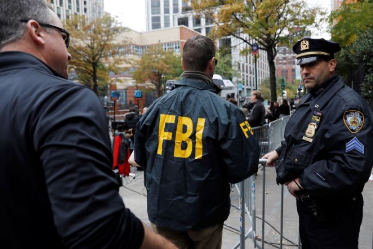 FBI agents enter through a police barricade along Chambers street a day after a man driving a rented pickup truck mowed down pedestrians and cyclists on a bike path alongside the Hudson River in New York City, in New York, U.S. November 1, 2017. REUTERS/Shannon Stapleton