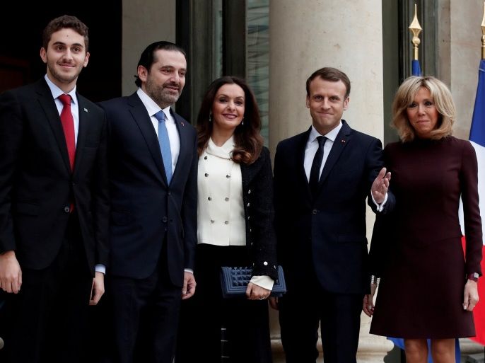 French President Emmanuel Macron and his wife Brigitte Macron, Saad al-Hariri, who announced his resignation as Lebanon's prime minister while on a visit to Saudi Arabia, his wife Lara and their son Houssam are pictured at the Elysee Palace in Paris, France, November 18, 2017. REUTERS/Benoit Tessier TPX IMAGES OF THE DAY