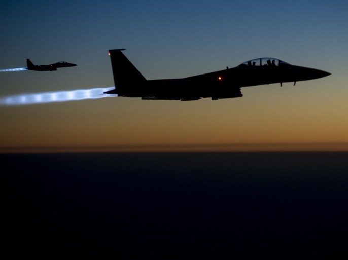 A pair of U.S. Air Force F-15E Strike Eagles fly over northern Iraq after conducting airstrikes in Syria, in this U.S. Air Force handout photo taken early in the morning of September 23, 2014. These aircraft were part of a large coalition strike package that was the first to strike ISIL targets in Syria. At least 14 Islamic State fighters were killed in air strikes by U.S.-led forces overnight in northeast Syria, a group monitoring the war said on September 25, 2014, and the Syrian air force bombed rebel areas in the west of the country. REUTERS/U.S. Air Force/Senior Airman Matthew Bruch/Handout (IRAQ - Tags: POLITICS CONFLICT) FOR EDITORIAL USE ONLY. NOT FOR SALE FOR MARKETING OR ADVERTISING CAMPAIGNS. THIS IMAGE HAS BEEN SUPPLIED BY A THIRD PARTY. IT IS DISTRIBUTED, EXACTLY AS RECEIVED BY REUTERS, AS A SERVICE TO CLIENTS. early in the morning of