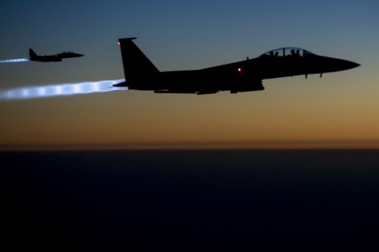 A pair of U.S. Air Force F-15E Strike Eagles fly over northern Iraq after conducting airstrikes in Syria, in this U.S. Air Force handout photo taken early in the morning of September 23, 2014. These aircraft were part of a large coalition strike package that was the first to strike ISIL targets in Syria. At least 14 Islamic State fighters were killed in air strikes by U.S.-led forces overnight in northeast Syria, a group monitoring the war said on September 25, 2014, and the Syrian air force bombed rebel areas in the west of the country. REUTERS/U.S. Air Force/Senior Airman Matthew Bruch/Handout (IRAQ - Tags: POLITICS CONFLICT) FOR EDITORIAL USE ONLY. NOT FOR SALE FOR MARKETING OR ADVERTISING CAMPAIGNS. THIS IMAGE HAS BEEN SUPPLIED BY A THIRD PARTY. IT IS DISTRIBUTED, EXACTLY AS RECEIVED BY REUTERS, AS A SERVICE TO CLIENTS. early in the morning of