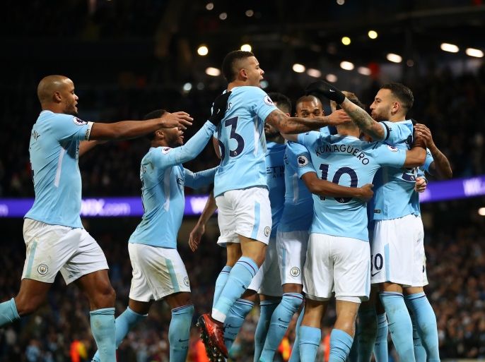 MANCHESTER, ENGLAND - NOVEMBER 29: Nicolas Otamendi of Manchester City celebrates his sides fist goal with his Manchester City team mates after Virgil van Dijk of Southampton scored a own goal during the Premier League match between Manchester City and Southampton at Etihad Stadium on November 29, 2017 in Manchester, England. (Photo by Clive Brunskill/Getty Images)