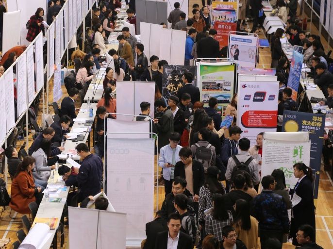 Job seekers attend a career fair in Zhengzhou University in Zhengzhou, Henan province, China November 17, 2017. Picture taken November 17, 2017. REUTERS/Stringer ATTENTION EDITORS - THIS IMAGE WAS PROVIDED BY A THIRD PARTY. CHINA OUT.