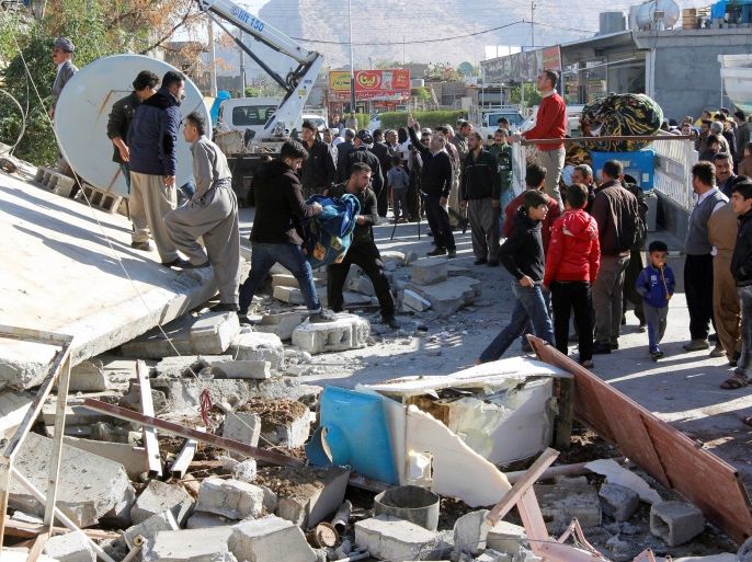 Residents look at a damaged building following an earthquake in the town of Darbandikhan, near the city of Sulaimaniyah, in the semi-autonomous Kurdistan region, Iraq November 13, 2017. REUTERS/Ako Rasheed
