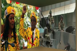 President Robert Mugabe and his wife Grace Mugabe + Soldiers are seen on the armoured vehicle outside the parliamen