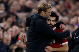 Soccer Football - Premier League - Liverpool vs Huddersfield Town - Anfield, Liverpool, Britain - October 28, 2017 Liverpool manager Juergen Klopp embraces Mohamed Salah after he is substituted off REUTERS/Phil Noble EDITORIAL USE ONLY. No use with unauthorized audio, video, data, fixture lists, club/league logos or