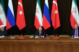 epa06344224 Russian President Vladimir Putin (C), Iranian President Hassan Rouhani (L) and Turkish President Recep Tayyip Erdogan (R) attend a joint news conference following their meeting in the Black sea resort of Sochi, Russia, 22 November 2017. Leaders of Russia, Turkey and Iran meet in Sochi to discuss settlement of the situation in Syria. EPA-EFE/MICHAEL KLIMENTYEV / SPUTNIK / KREMLIN POOL MANDATORY CREDIT