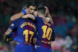 BARCELONA, SPAIN - NOVEMBER 04: Paco Alcacer (L) of FC Barcelona celebrates scoring their opening goal with teammates Luis Suarez (2ndL) and Lionel Messi (R) during the La Liga match between FC Barcelona and Sevilla FC at Camp Nou stadium on November 4, 2017 in Barcelona, Spain. (Photo by Gonzalo Arroyo Moreno/Getty Images)