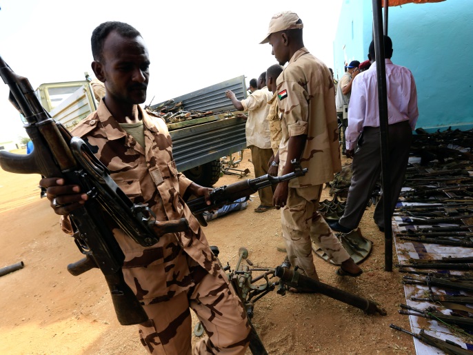 Rapid Support Forces upload disarmed weapons for display during Sudanese President Omar al-Bashir visit to the war-torn Darfur region at Rapid Support Forces Headquarter in Umm Al-Qura, Darfur, Sudan September 23, 2017. REUTERS/Mohamed Nureldin Abdallah