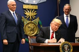 U.S. President Donald Trump (C) signs an Executive Order establising extreme vetting of people coming to the United States after attending a swearing-in ceremony for Defense Secretary James Mattis (R) with Vice President Mike Pence at the Pentagon in Washington, U.S., January 27, 2017. The executive order signed by Trump imposes a four-month travel ban on refugees entering the United States and a 90-day hold on travelers from Syria, Iran and five other Muslim-majority countries. REUTERS/Carlos Barria