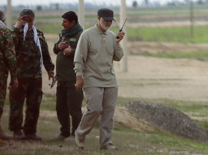 Iranian Revolutionary Guard Commander Qassem Soleimani uses a walkie-talkie at the frontline during offensive operations against Islamic State militants in the town of Tal Ksaiba in Salahuddin province March 8, 2015. Picture taken March 8, 2015. REUTERS/Stringer (IRAQ - Tags: CIVIL UNREST CONFLICT POLITICS)
