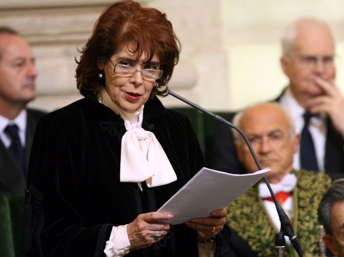 Assia Djebar (standing) delivers her acceptance speech at the Academie Francaise in Paris June 22, 2006. Djebar, who has written extensively about the life of [Muslim] women, is the first Algerian woman to enter the official guardian of the French language, the Academie Francaise, founded in 1635.