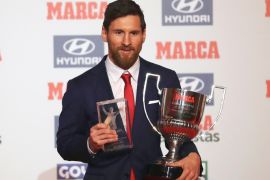 epa06397403 FC Barcelona's Argentinian striker Lionel Messi poses with his Pichichi Award for the best male goal scorer and the Di Stefano Award for the best player in the Spanish Primera Division 2016-2017 season during the Marca Sports Journal Award Ceremony in Barcelona, northeastern Spain, 18 December 2017. EPA-EFE/ALEJANDRO GARCIA