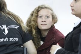 epa06399700 17 year old Palestinian Ahed Tamimi (C), a campaigner against Israel's occupation, appears at a military court at the Israeli-run Ofer prison in the West Bank village of Betunia, 20 December 2017.