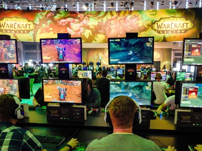 GERMANY - AUGUST 17: Visitors try out the massively multiplayer online role-playing game 'World Of Warcraft' at the Blizzard Entertainment stand at the Gamescom 2016 gaming trade fair during the media day on August 17, 2016 in Cologne, Germany. Gamescom is the world's largest digital gaming trade fair and will be open to the public from August 18-21. (Photo by Sascha Schuermann/Getty Images)