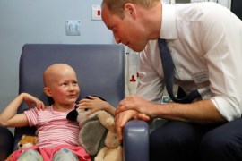 LONDON, UNITED KINGDOM - MAY 16: Prince William, Duke of Cambridge talks with patient Daisy Wood, 6, during a visit to the Royal Marsden hospital on May 16, 2017 in Sutton, England. The Duke of Cambridge, President of the Royal Marsden NHS Foundation Trust, visited the hospital's facilities in Sutton. During the visit, which marks 10 years since His Royal Highness became President of the centre, The Duke accompanied staff as they went about their daily activities in