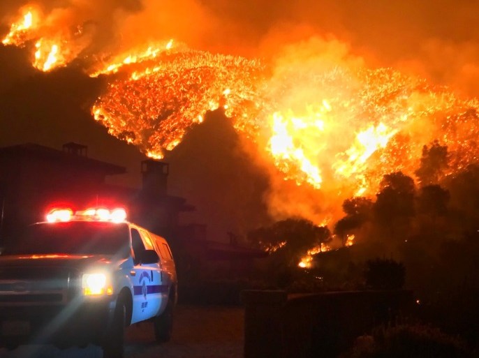Thomas wildfire burns above Bella Vista Drive near Romero Canyon in this social media photo by Santa Barbara County Fire Department in Montecito, California, U.S. December 12, 2017. Courtesy Mike Eliason/Santa Barbara County Fire Department/Handout via REUTERS ATTENTION EDITORS - THIS IMAGE HAS BEEN SUPPLIED BY A THIRD PARTY.
