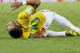 Brazil's Neymar lies injured on the pitch after a challenge by Colombia's Camilo Zuniga (unseen) during their 2014 World Cup quarter-finals at the Castelao arena in Fortaleza July 4, 2014. REUTERS/Marcelo Del Pozo (BRAZIL - Tags: SOCCER SPORT WORLD CUP)