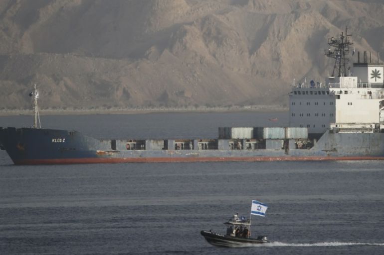 An Israeli Navy boat escorts the Panamanian-flagged cargo vessel Klos C into the Israeli port of Eilat on Saturday after seizing it in the Red Sea on Wednesday, March 8, 2014. Israel said the Klos C was carrying dozens of advanced Iranian-supplied weapons made in Syria and intended for Palestinian guerrillas in the Gaza Strip. REUTERS/Finbarr O'Reilly (ISRAEL - Tags: POLITICS MILITARY TPX IMAGES OF THE DAY)