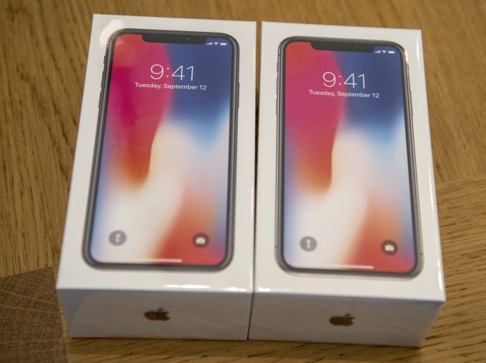 LONDON, ENGLAND - NOVEMBER 03: iPhone X handsets are purchased in the Apple store upon its release in the U.K, on November 3, 2017 in London, England. The iPhone X is positioned as a high-end, model intended to showcase advanced technologies such as wireless charging, OLED display, dual cameras and a face recognition unlock system. (Photo by Carl Court/Getty Images)