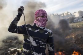 RAMALLAH, WEST BANK - DECEMBER 11: Palestinian youth clash with Israeli Defence Forces in the streets on December 11, 2017 in North of Ramallah, West-Bank. Protest continues into the sixth day in an already divided city, U.S. President Donald Trump pushed relations in the city to breaking point after making the announcement to recognize Jerusalem as Israel's capital. (Photo by Ilia Yefimovich/Getty Images)