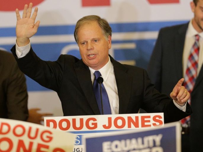 Democratic Alabama U.S. Senate candidate Doug Jones acknowledges supporters at the election night party in Birmingham, Alabama, U.S., December 12, 2017. REUTERS/Marvin Gentry