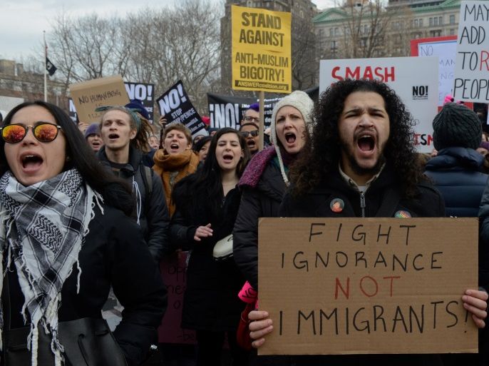 People participate in a protest against U.S. President Donald Trump's immigration policy and the recent Immigration and Customs Enforcement (ICE) raids in New York City, U.S. February 11, 2017. REUTERS/Stephanie Keith
