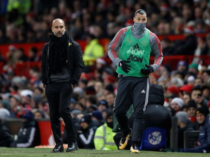 Soccer Football - Premier League - Manchester United vs Manchester City - Old Trafford, Manchester, Britain - December 10, 2017 Manchester City manager Pep Guardiola looks on as Manchester United's Zlatan Ibrahimovic warms up during the game Action Images via Reuters/Carl Recine EDITORIAL USE ONLY. No use with unauthorized audio, video, data, fixture lists, club/league logos or