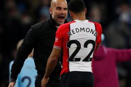 Soccer Football - Premier League - Manchester City vs Southampton - Etihad Stadium, Manchester, Britain - November 29, 2017 Manchester City manager Pep Guardiola talks to Southampton's Nathan Redmond, who looks dejected, at the end of the match Action Images via Reuters/Lee Smith EDITORIAL USE ONLY. No use with unauthorized audio, video, data, fixture lists, club/league logos or