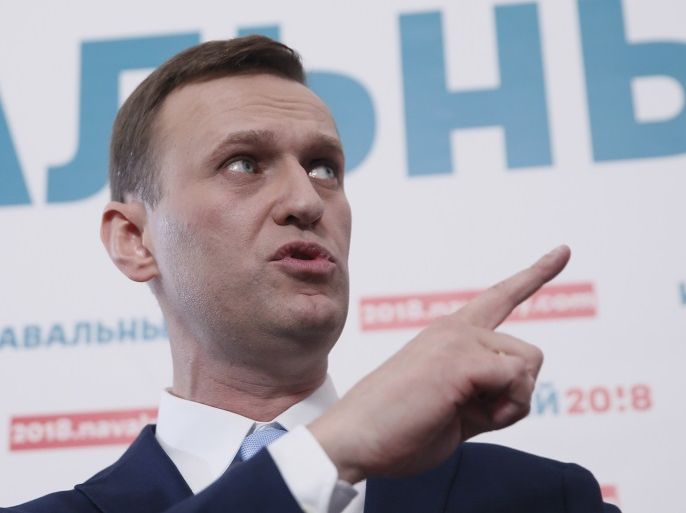 Russian opposition leader Alexei Navalny delivers a speech during a meeting to uphold his bid for presidential candidate, in Moscow