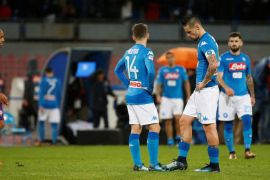 Soccer Football - Serie A - Napoli vs Fiorentina - Stadio San Paolo, Naples, Italy - December 10, 2017 Napoli's Marek Hamsik looks dejected after the match with Dries Mertens and team mates REUTERS/Ciro De Luca
