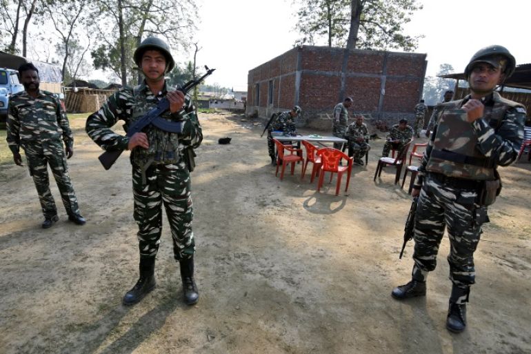 Central Reserve Police Force (CRPF) personnel stand guard at a temporary camp ahead of the publication of the first draft of the National Register of Citizens (NRC) in the Juria village of Nagaon district in the northeastern state of Assam, India, December 28, 2017. REUTERS/Anuwar Hazarika