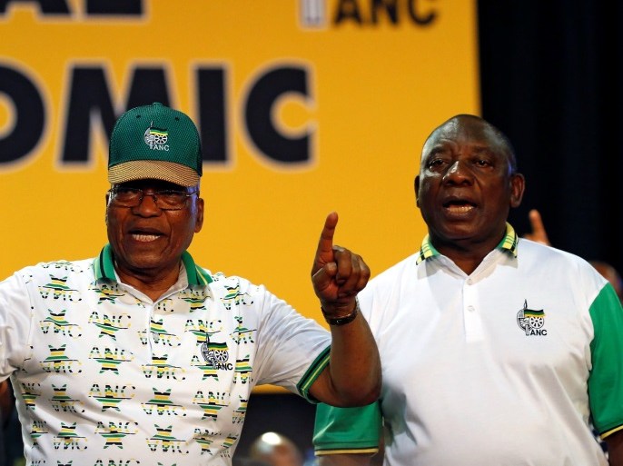 South Africa's President Jacob Zuma sings next to newly elected president of the ANC Cyril Ramaphosa during the 54th National Conference of the ruling African National Congress (ANC) at the Nasrec Expo Centre in Johannesburg, South Africa December 18, 2017. REUTERS/Siphiwe Sibeko