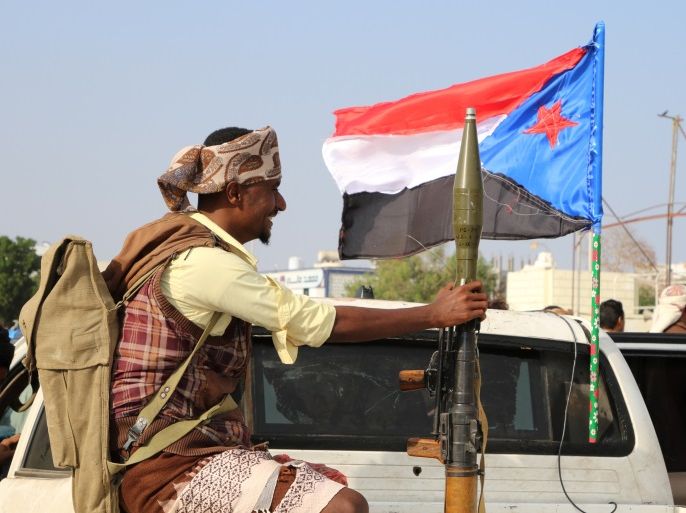 A bodyguard of a southern Yemeni separatist leader holds an RPG launcher as he rides on the back of a pick-up truck at the site of an anti-government protest in Aden, Yemen January 28, 2018. REUTERS/Fawaz Salman