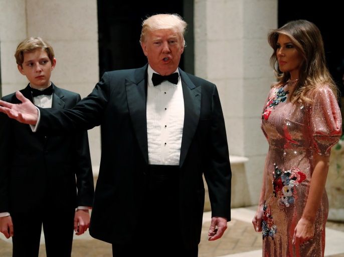 U.S. President Donald Trump and first lady Melania Trump, with their son Barron, arrive for a New Year's Eve party at his Mar-a-Lago club in Palm Beach, Florida, U.S. December 31, 2017. REUTERS/Jonathan Ernst